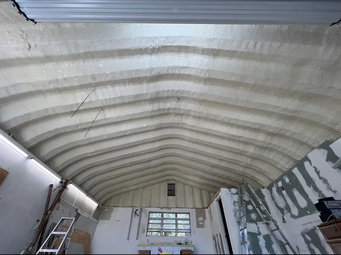 Spray polyurethane foam applied to the underside of a metal roof deck in San Lorenzo
